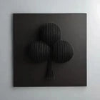 Black three-leaf clover-shaped object on a white background