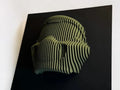 Green and black striped helmet on a black background Doom
