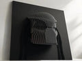 Predator Black 3D wall art of a helmet on a dark background