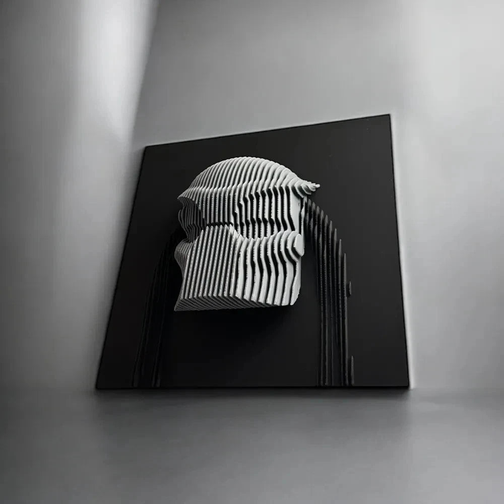 Predator Black and white abstract sculpture on a black platform against a gray background