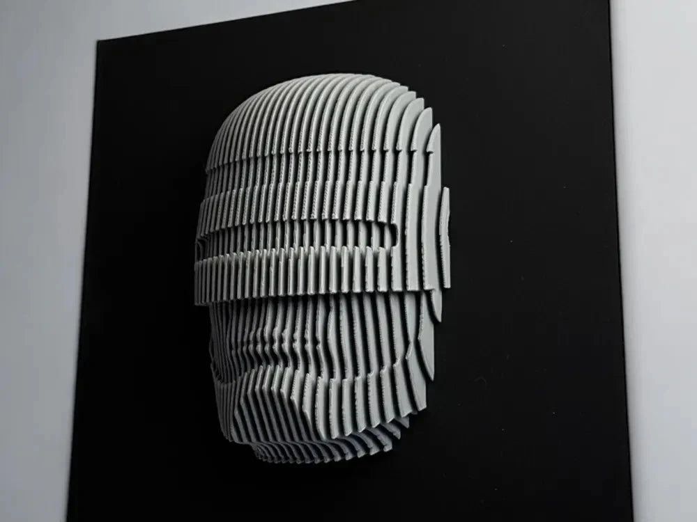 Robocop 3D paper sculpture of a face on a black background