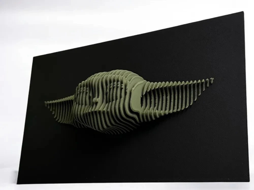 Grogu Green 3D printed object on a black background