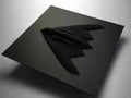 Northrop B-2 Stealth Bomber Black square object with a wing-like design on a gray background