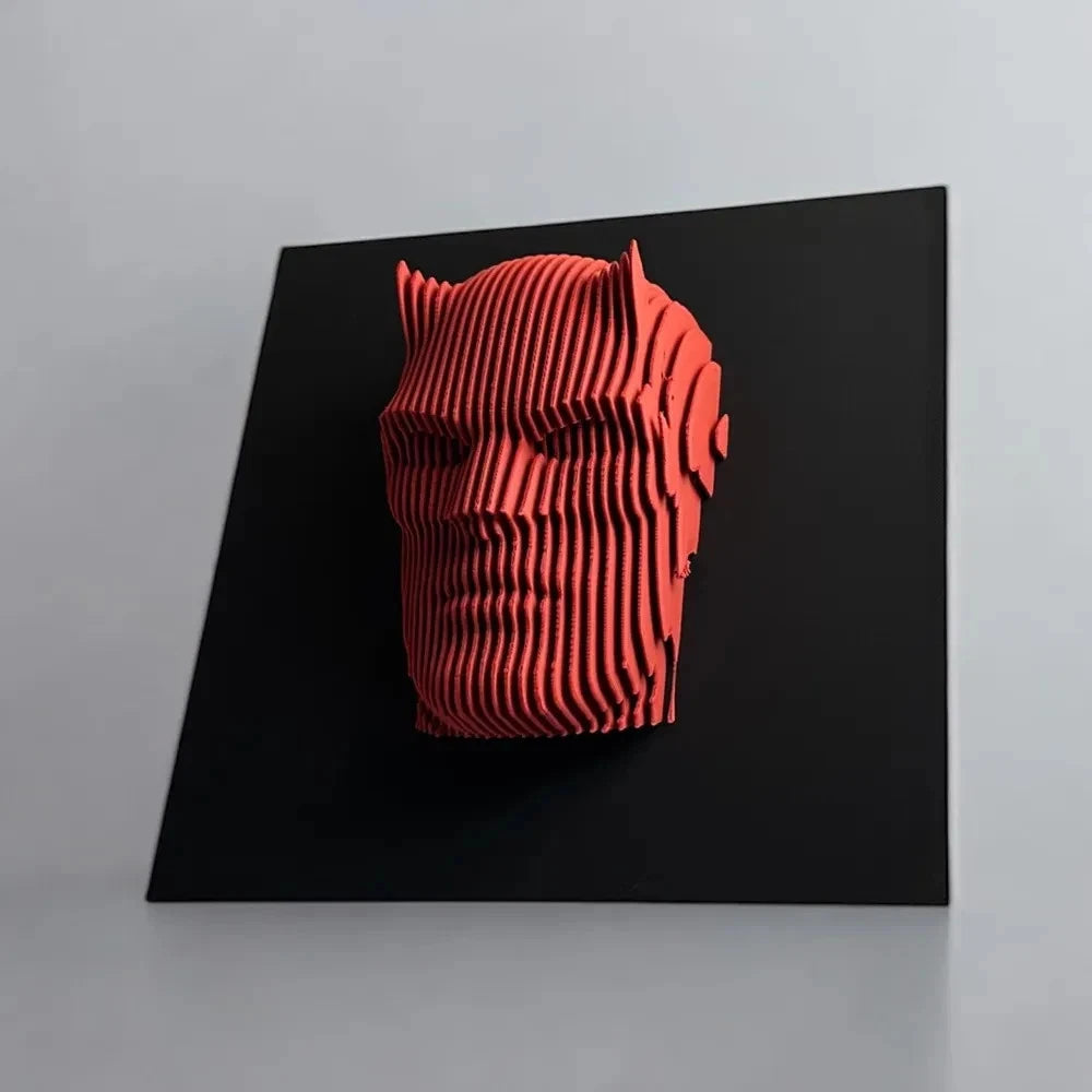 Daredevil  Red 3D geometric sculpture on a black square platform with a gray background