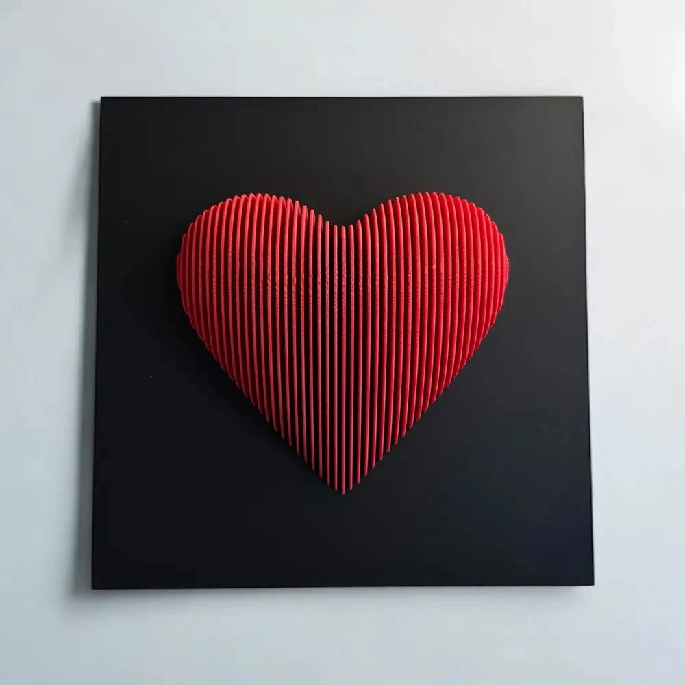 Red heart-shaped object on a black background