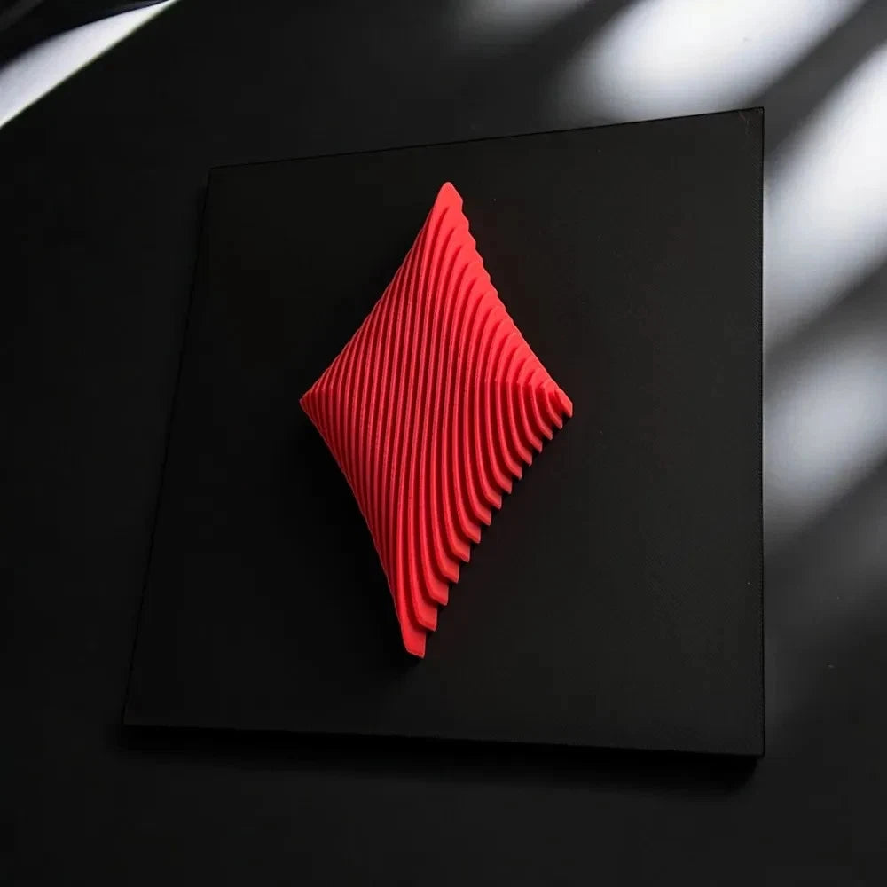 Red geometric sculpture on a black background